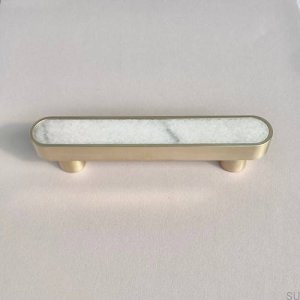 Elongated furniture handle. Brass. Brushed Pink Marble