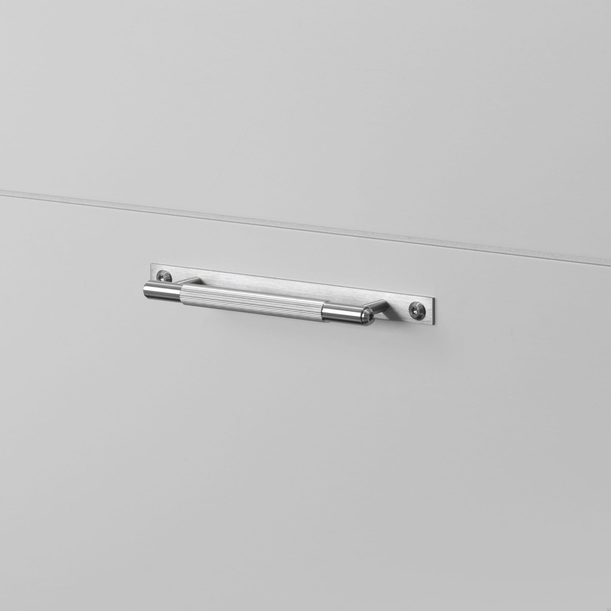 1.BusterPunch_Pull_Bar_Plate_Small_Linear_Steel-scaled.jpg