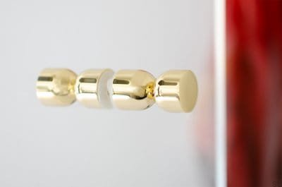 Kokeshi 1832 double-sided furniture knob, polished brass, unvarnished