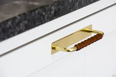 Elongated furniture handle with a Royal Deluxe pad 128 Brass Brown Leather