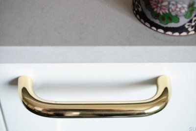 Grip 143 elongated furniture handle, polished brass