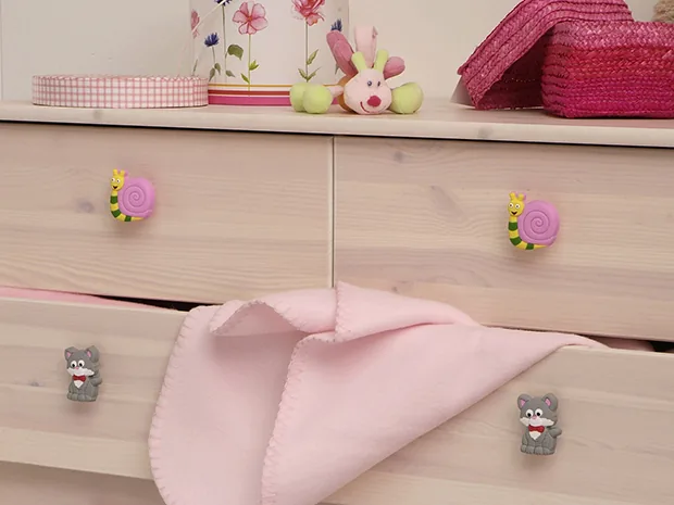Children's rubber knobs on a chest of drawers